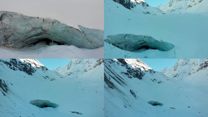 从冰川洞穴俯瞰，驶出瑞士瓦莱州一个偏远的雪覆盖的山谷，在寒冷的冬日，太阳开始在山峰上落下。