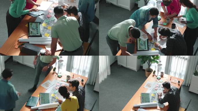 聪明的工程师团队共同合作规划建筑施工。研讨会。