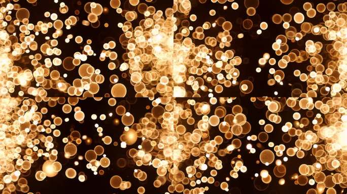 抽象的金色辉光散景气泡粒子在黑色背景上飞舞。橙红色金色散景粒子尘埃在空气中飞扬，超慢动作摄像机以10