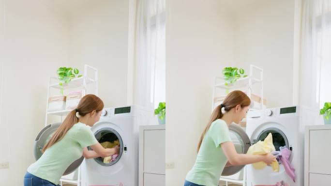 亚洲家庭主妇卸下洗好的衣物