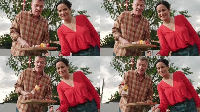 家庭在花园里一起露营，老夫妻在烤烧烤。分歧。