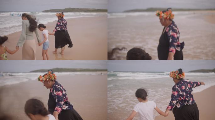 太平洋岛屿母亲和她的女儿们在马鲁布拉海滩享受共度时光。