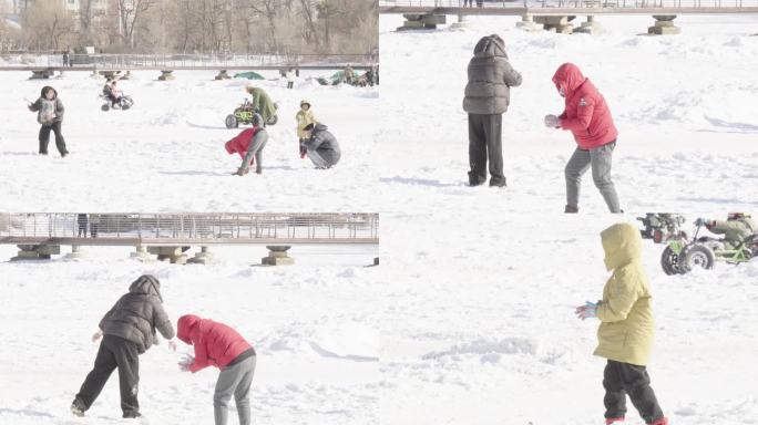 雪地中亲子打雪仗互动玩耍