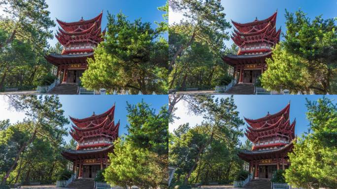 古风红漆建筑被绿树环绕的景象 永康金胜山