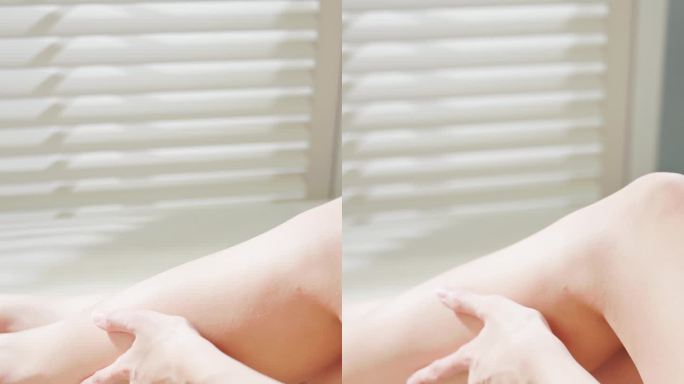 女人轻抚和抚摸腿部。