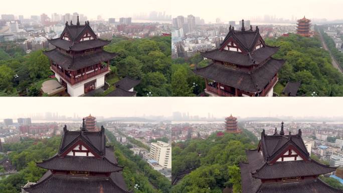 武汉，中国 - 2025年1月19日：现代城市天际线中传统建筑的鸟瞰图。
