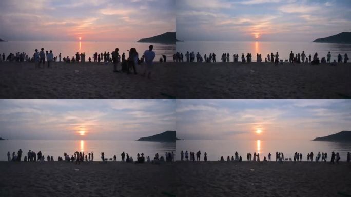海滩日出人群剪影