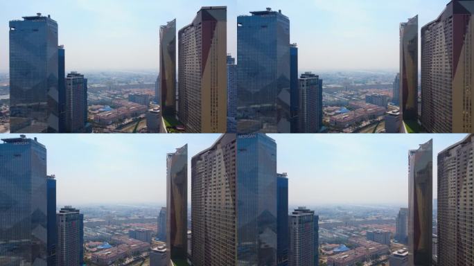 摩根设计的住宅公寓综合体天际线建筑，位于金边市的托尔巴萨克河附近的峰景公寓1号和2号塔楼，笼罩在雾霾