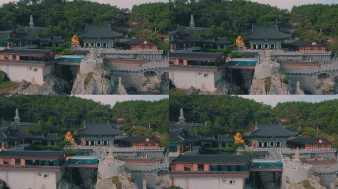 韩国釜山 - 2024年10月19日：在迷人的海滨地点探索风景如画的海岸建筑，包括寺庙和雕像。
