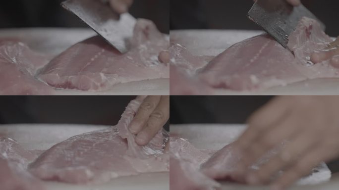 厨师切割新鲜鱼肉片肉特写