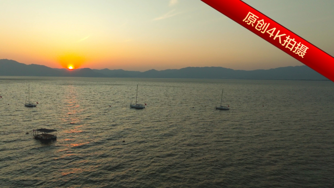 平静海面金色夕阳 海滩日落帆船剪影