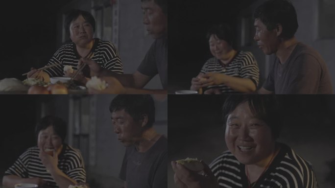 农家夫妇在老屋小院吃饭