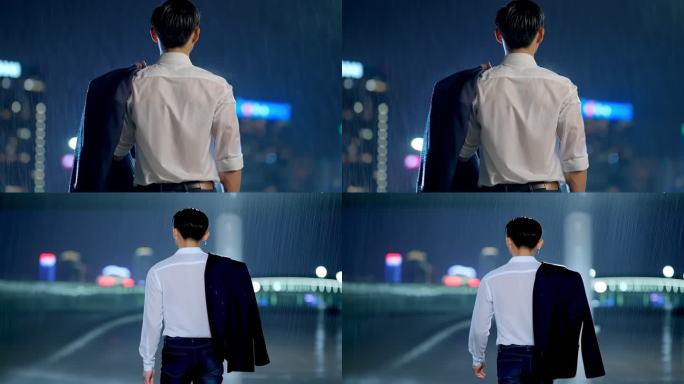 夜晚男子淋雨背影