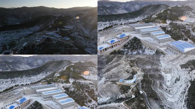 冬季雪山下的建筑群村落风光鸟瞰航拍