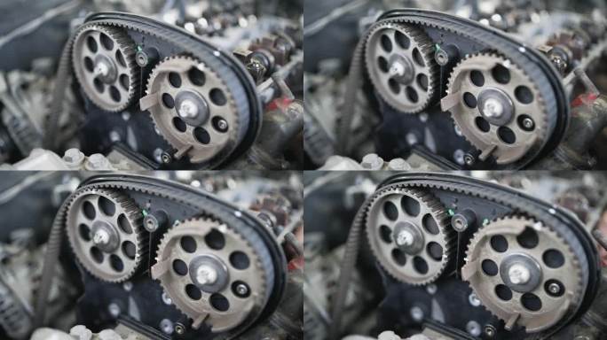 车间内汽车正时皮带和发动机部件的特写镜头