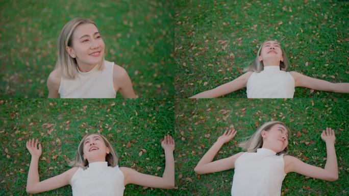 年轻的亚洲女性在躺在草地上之前深吸一口新鲜空气。