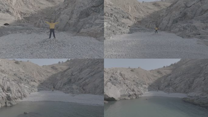 航拍威海靖子头鹅卵石海滩黄色冲锋衣飞手