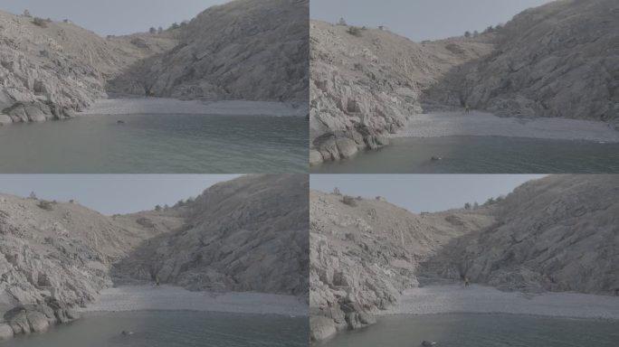 航拍威海靖子头鹅卵石海滩黄色冲锋衣飞手