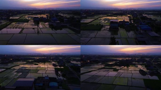 夕阳下的稻田村庄景观航拍