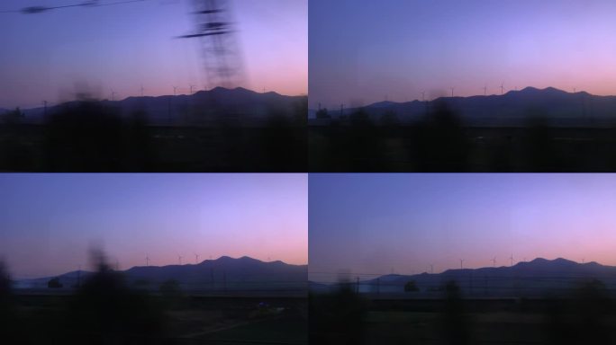 紫色天空下的风力发电场