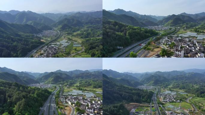高速公路航拍穿过群山徽派村庄