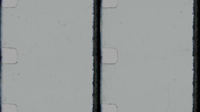 磨损边缘和灰尘颗粒的8毫米老电影胶卷。