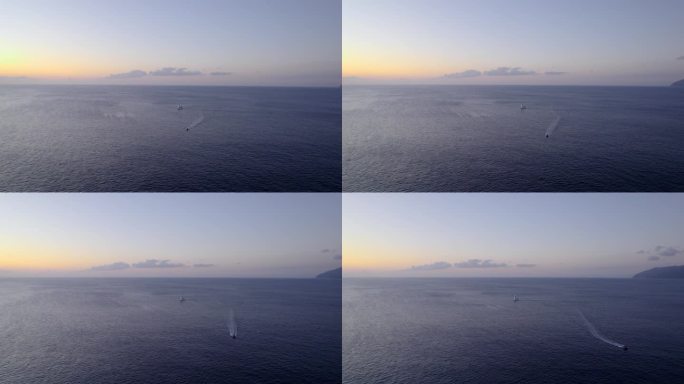 宁静的海景，船只与渐变天空。