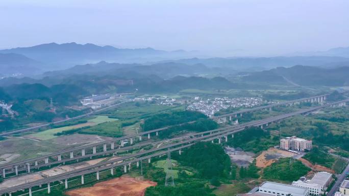航拍高铁穿过山区小城高架桥