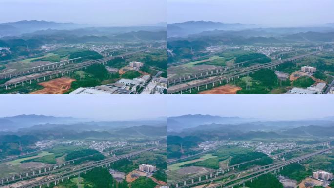 航拍高铁穿过山区小城高架桥