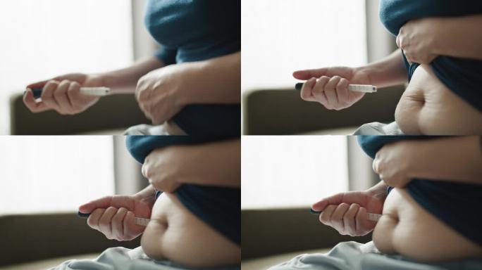 女人在腹部注射自己。