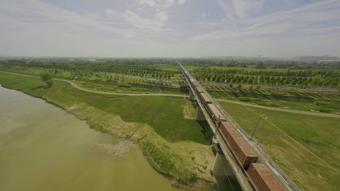 穿梭航拍中欧班列经过铁路桥梁中国铁路轨道