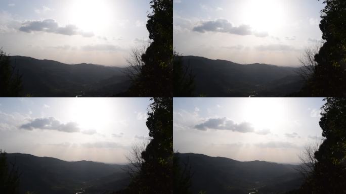 阳光穿透云层的山景