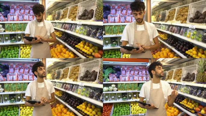 超市店员在生鲜食品区使用数字平板电脑。