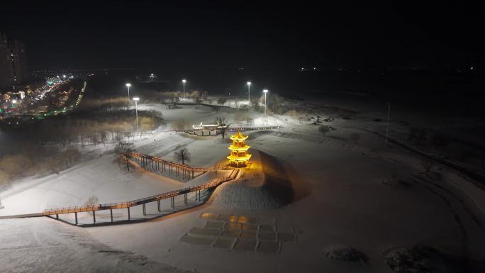 冬日雪景公园塔楼渐远航拍