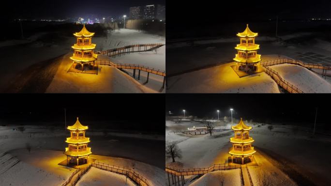 佳木斯沿江公园雪夜塔楼环绕航拍