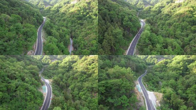 绿色山谷公路航拍蜿蜒山路乡村公路乡村振兴