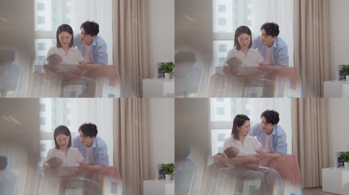 年轻夫妇温馨照料新生儿