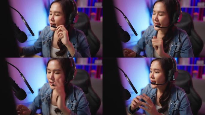专业的年轻女性博主/玩家流媒体直播视频，并对着麦克风在家庭演播室说话。通讯技术与娱乐理念。