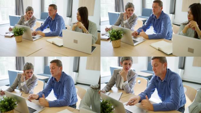 白人同事，男女，一起在办公室工作