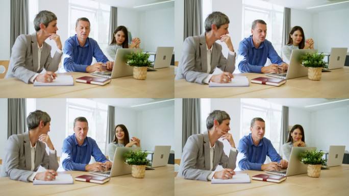 现代白人同事，一起在办公室工作