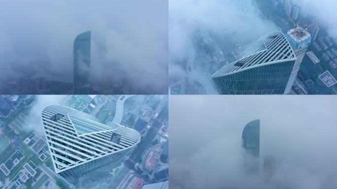 苏州云雾缭绕的城市日出景观与地标建筑风景