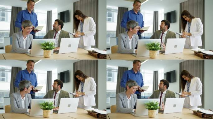 男女同事，一起在办公室工作