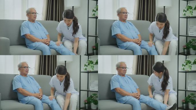 身穿白大褂的女医护人员在家访期间为高级男病人腿部问题咨询。老年人医疗保健概念。