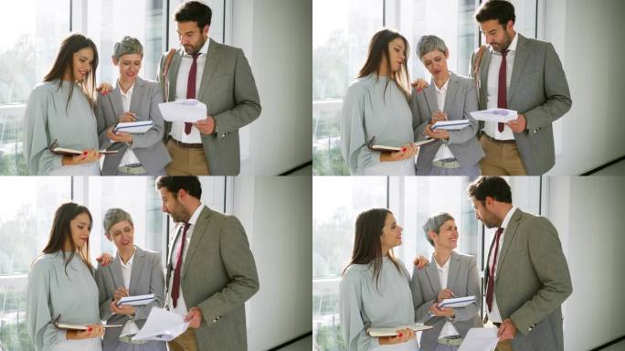 白人女性和男性同事一起处理文书工作