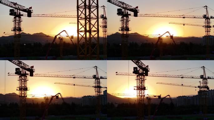 夕阳下的建筑工地剪影航拍塔吊