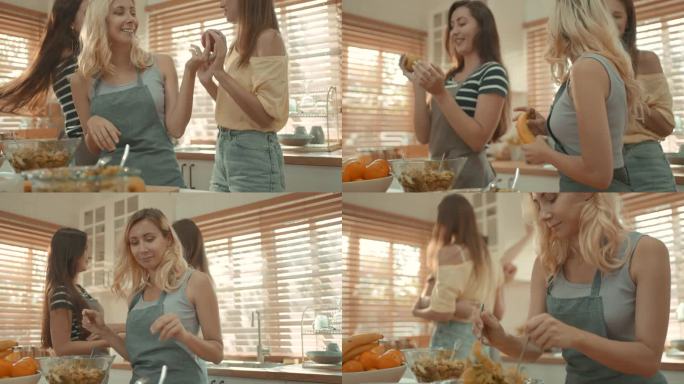 女团正在厨房里享受准备食物和跳舞的乐趣