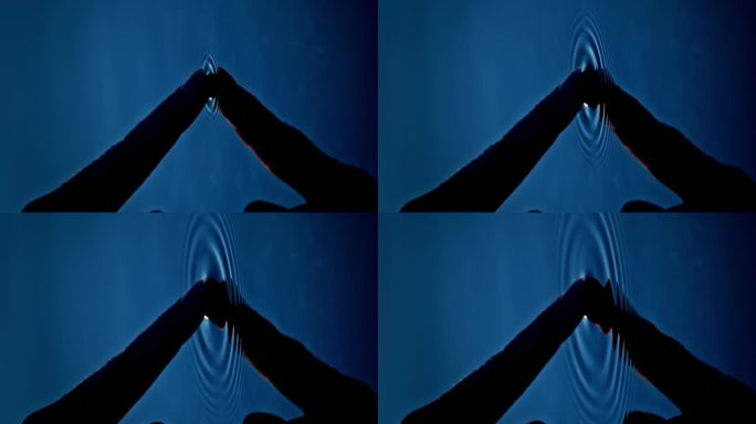 慢动作:手指触摸水面。幻想:进入另一个世界