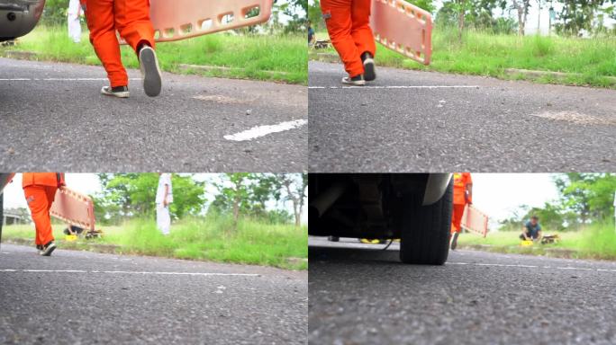 救护小组抢救一名车祸受害者的受伤人员