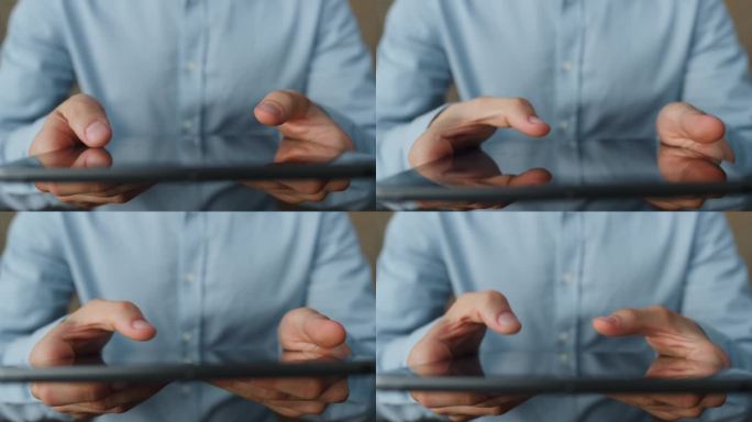 男子双手操作平板电脑近距离。未知商人手持tab电脑。