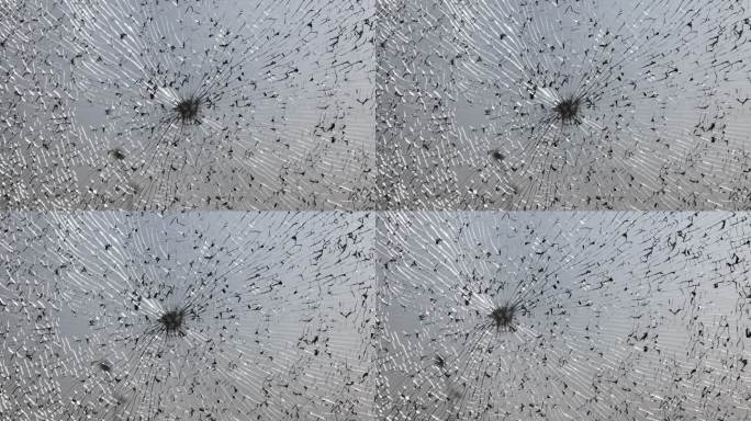 汽车破碎的挡风玻璃特写作为背景。有裂纹的碎玻璃纹理。